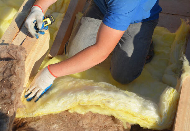 Contractor Insulating with Mineral Wool Attic Roof at wilton